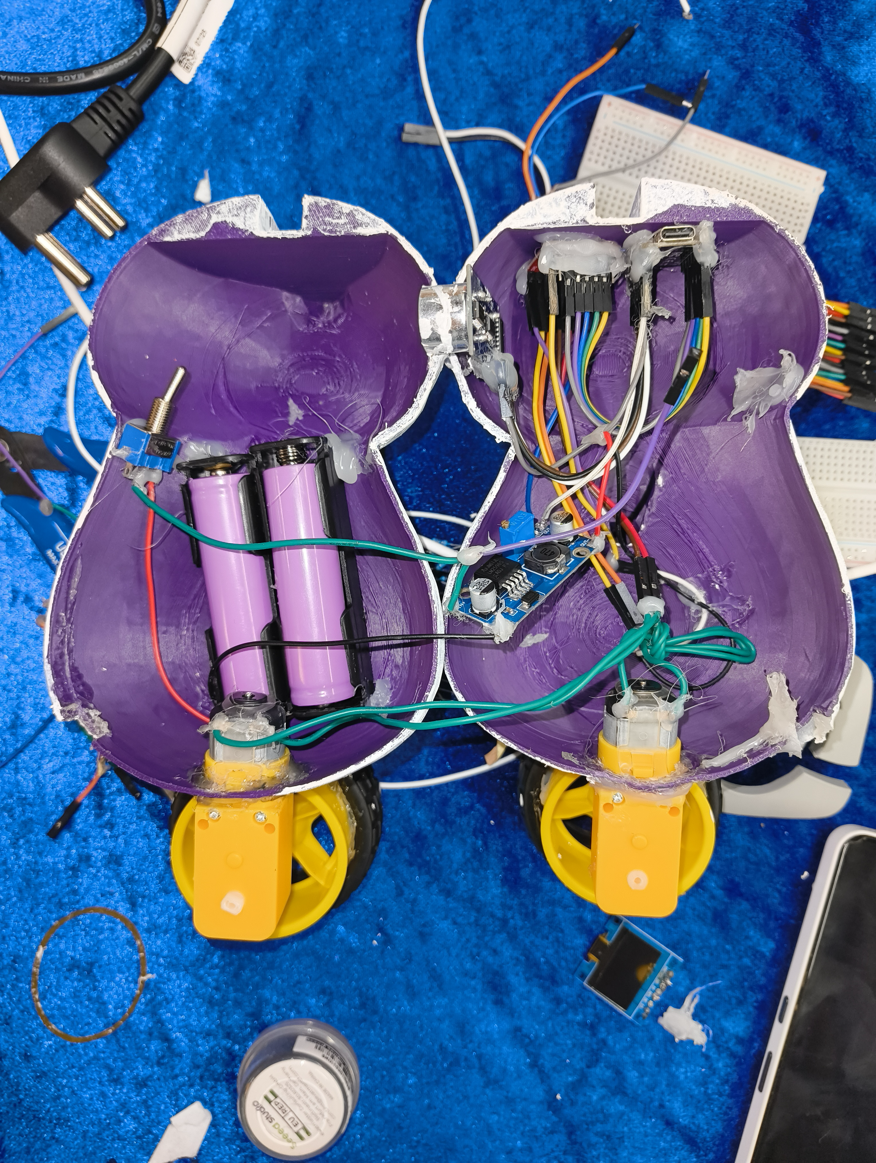Photo of AliPayBot’s exposed wiring and electronics during assembly.